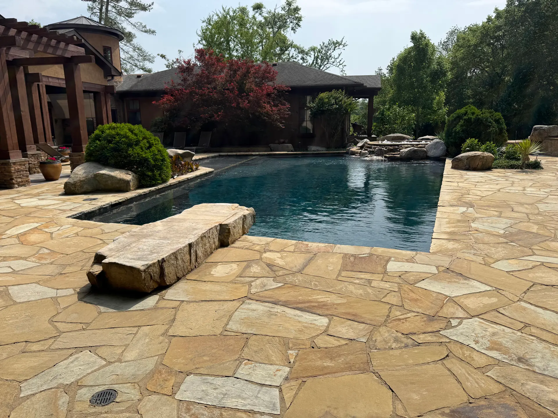 Custom pool and flagstone hardscape built by LCB Construction